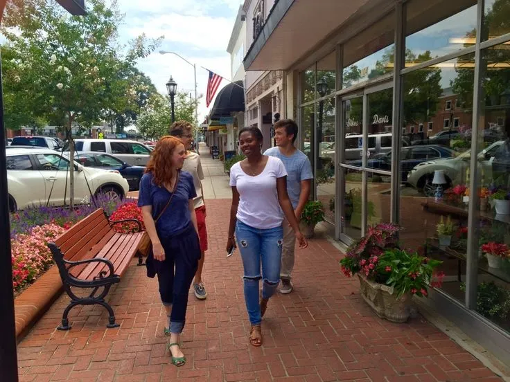 Open office with employees engaged in brief movement activities